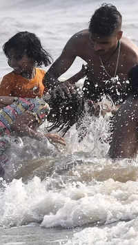 Kids take bath at Mumbai's Juhu Beach​