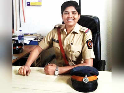 Women police officials help homeless woman deliver on pavement at Marine Lines in South Mumbai