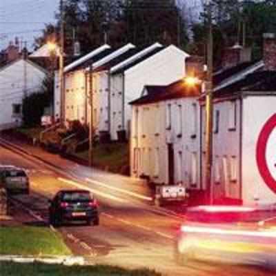 Man paints 15-ft high '˜go slow' sign on house