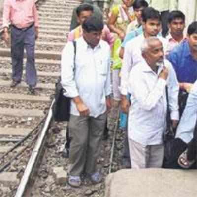 Youths build path so passengers don't cross railway tracks