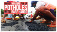 Mumbai rains: MMRDA workers fill up potholes with bare hands 