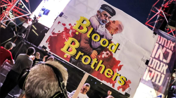 Israel PM embraces Hamas' leader in poster