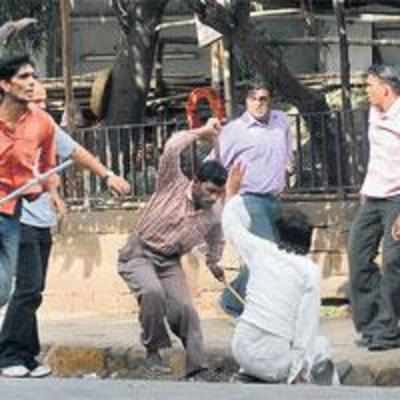 MNS men rain sticks, blows on SP workers