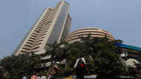 Equity indices end flat after volatile trade, metal stocks gain 