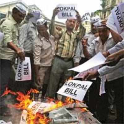 Lokpal Bill tabled, protests in and out of Parliament