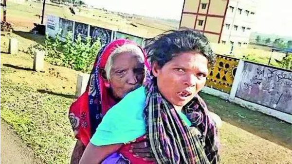 For KYC, tribal woman walks 4km to bank with mom-in-law, 90, on her back