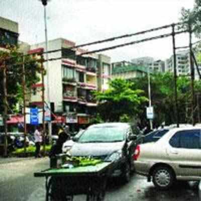 Ganpati mandals dig holes on arterial roads for erecting hoardings