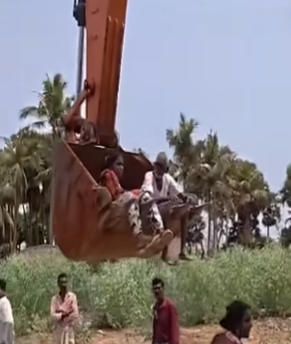 Elderly couple lifted in excavator bucket during Bhogapuram airport road protest in Andhra Pradesh