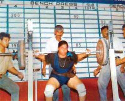 Gutsy power-lifter beats cancer, strikes gold