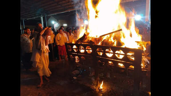 Amid teary chants, thousands converge for final farewell