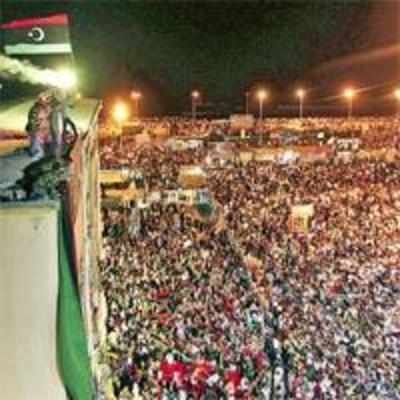 As Tripoli falls to rebels, Gaddafi is heard, not seen