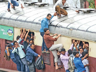 Man falls to death from overcrowded local train