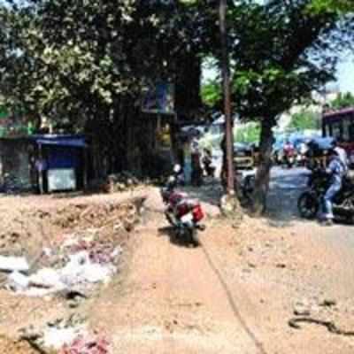 Sewage lines pose hurdles for service road work along GB road