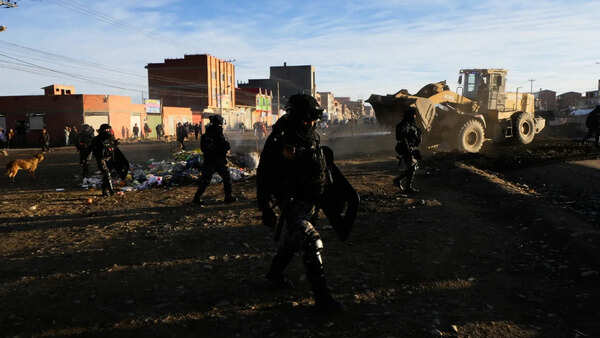 Bolivian police confront protesters blockading roads