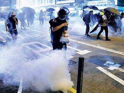 HK cops fire tear gas as protests resume