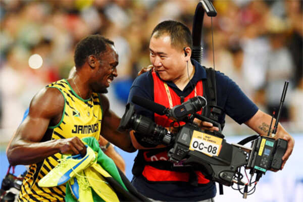 Only man who can topple Usain Bolt: A photographer on a scooter