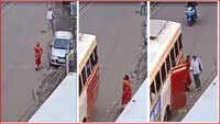 Woman helps visually impaired person to board a bus 