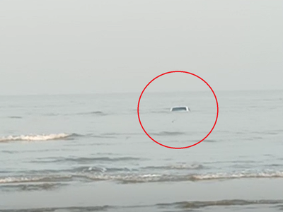 Car parked at the beach in Vasai swept away with the tide