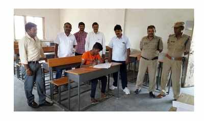 Andhra Pradesh: Boy writes exam under strict vigil by seven officials