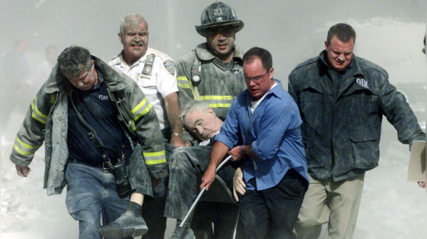 Rescue workers carry wounded Chaplain
