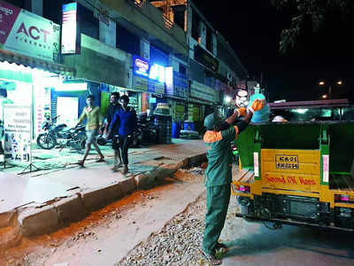 Even at night, they keep time for waste collection