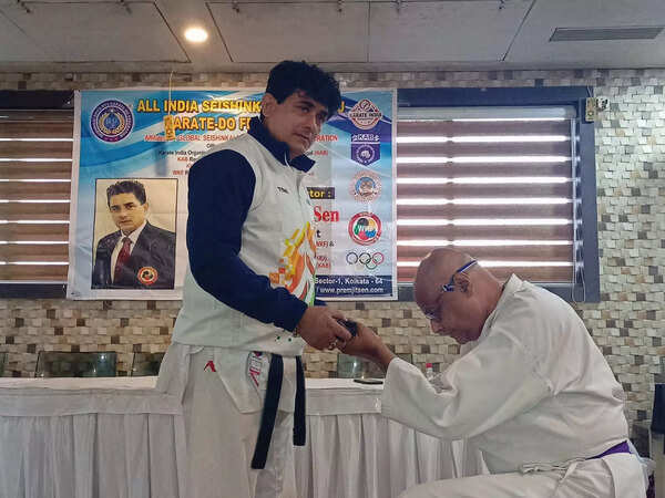 Sixty-year-old scientist ranks up to brown belt in karate
