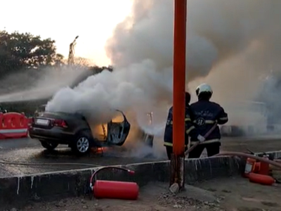 Watch: Moving car catches fire near Mulund toll naka; no injuries reported
