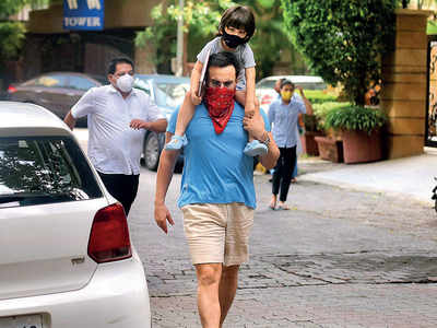 Mask on: Saif Ali Khan, Taimur step out in Bandra on Sunday