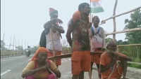 Four sons carry their parents on shoulder for Kanwar Yatra 