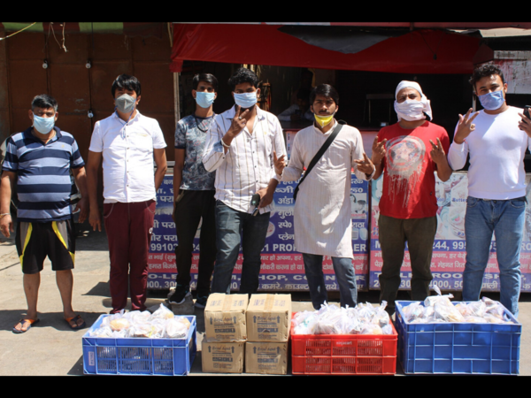 No curfew pass, police support helps this group distribute food