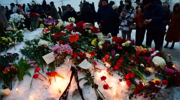 Flowers and chants mark Navalny's last rites in Moscow