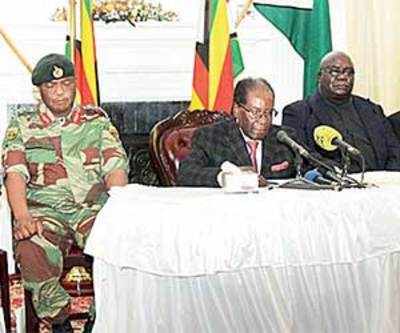 Robert Mugabe defies deadline to resign, faces impeachment