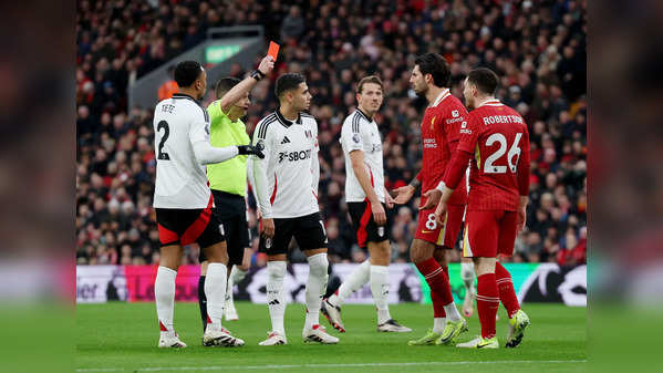 10-man Liverpool holds on for 2-2 draw with Fulham, Arsenal misses chance to close gap