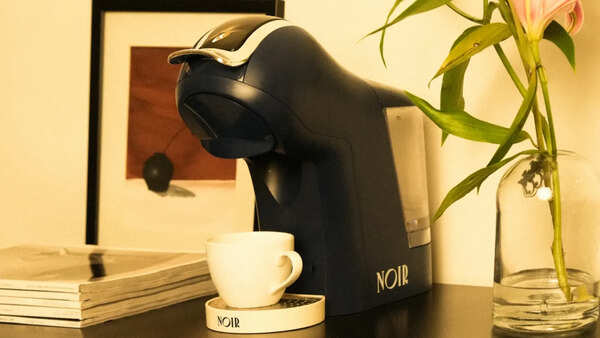 The Noir Azure coffee machine, and a coffee shelf that's finally shrinking