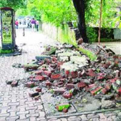 Housing society's compound wall collapses, 2 men, boy injured