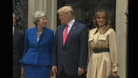 Donald Trump tells Theresa May to 'stick around' 