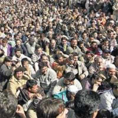 Striking J&K government employees take out rally