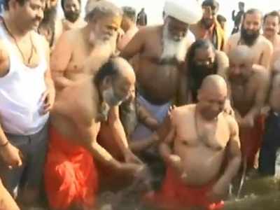 CM Yogi Adityanath, ministers take dip in Sangam