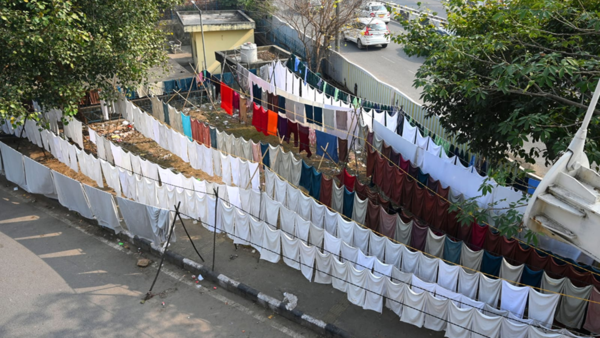 Invisible under busy flyover, people who do Delhi's laundry