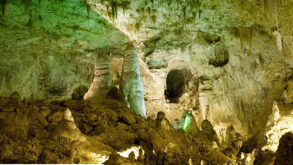 Neon green wall discovered in a pitch-black New Mexico cave may be 9 million years old