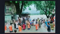Karnataka floods: Locals dance on waterlogged National Highway at Yamagarni village in Belagavi 