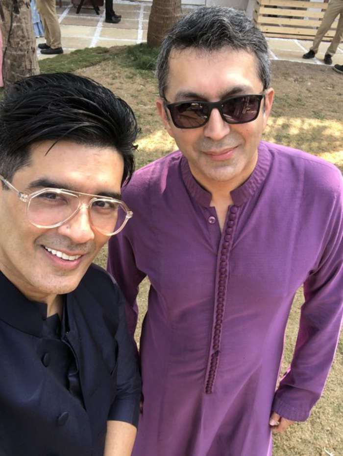 Manish Malhotra and Kunal Kohli pose for a selfie at Varun-Natasha's wedding