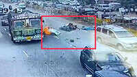 Shocking visuals: Two-wheeler goes up in flames after speeding car rams into vehicles at a traffic signal 