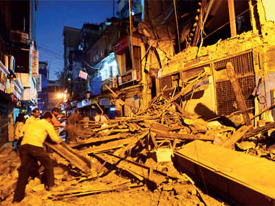 Portion of 100-yr-old building collapses