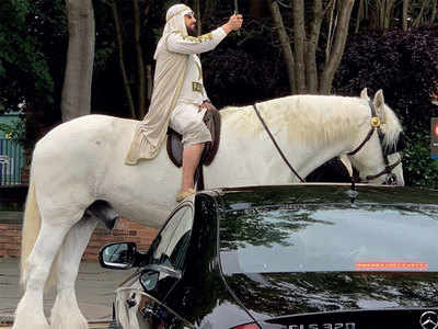 Pak fan arrives on horseback
