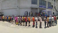Covid-19: Migrant workers from Odisha queue up for medical certificates in Surat 