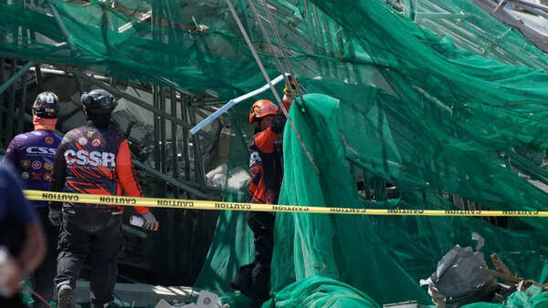 Rescuers search for 23 missing at collapsed Philippine building
