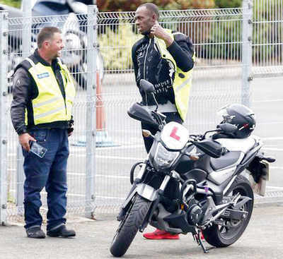 After Olympic Games triple triple, Bolt learns to ride a bike