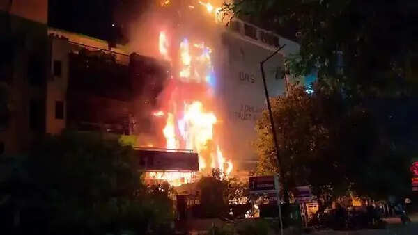 Second fire in a month burns down part of biz complex, nearby flat
