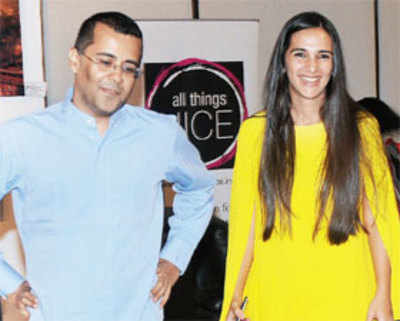 Chetan Bhagat accompanies  Tara Sharma at  an art exhibition